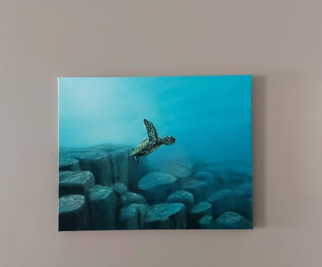An acrylic painting of a baby turtle swimming over rocks in the deep blue ocean. After snorkeling in Molokini Crater in Maui, I learned that this location inspired the creators of Finding Nemo to write the famous "drop-off" scene. I felt an urge to capture this moment as a painting thanks to photographer Jeremy Bishop. 16 x 20" acrylic on canvas
