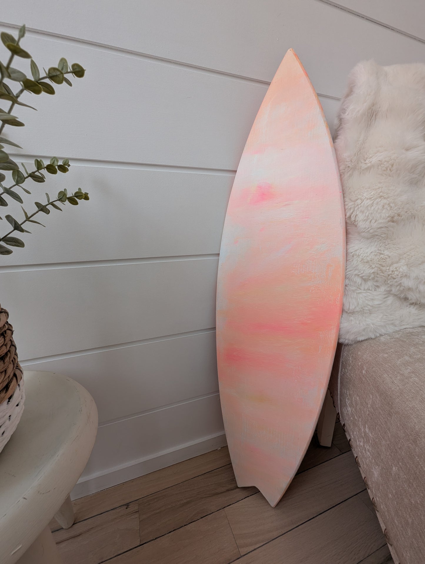 double-sided_surfboard_wall_art_painting_in_peach_coral_and_white_acrylic_on_wood_with_wooden_hanging_ledge