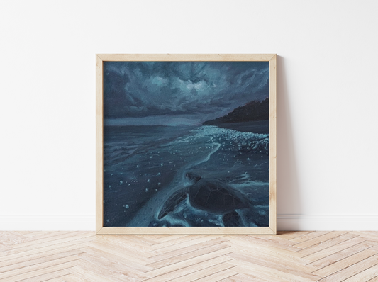 Dark blue ocean painting on canvas showing a sea turtle on a moonlit beach, framed in natural wood