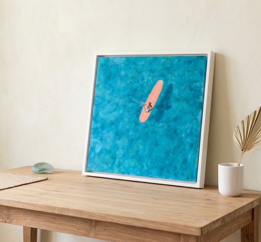 Teal ocean surfer painting on wood panel, aerial view of woman on coral pink surfboard in turquoise water