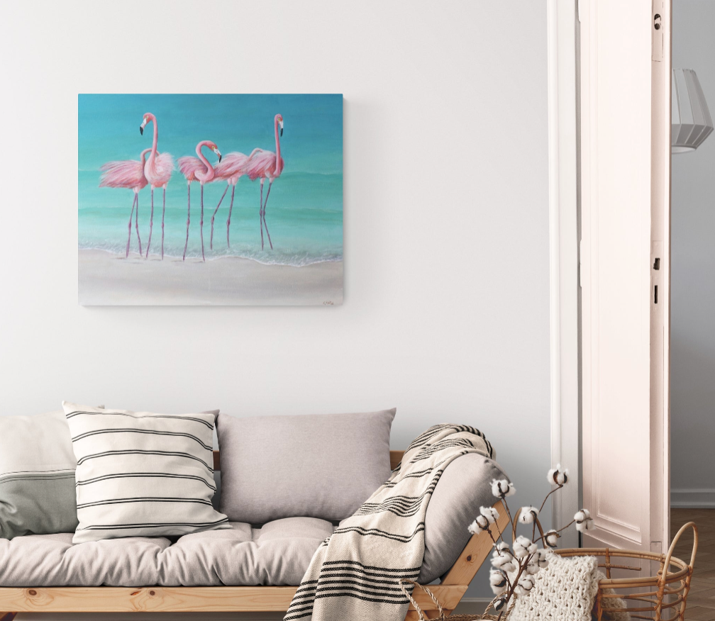 Large pink flamingo painting on canvas framed in driftwood, styled above a console table in a coastal boho living room