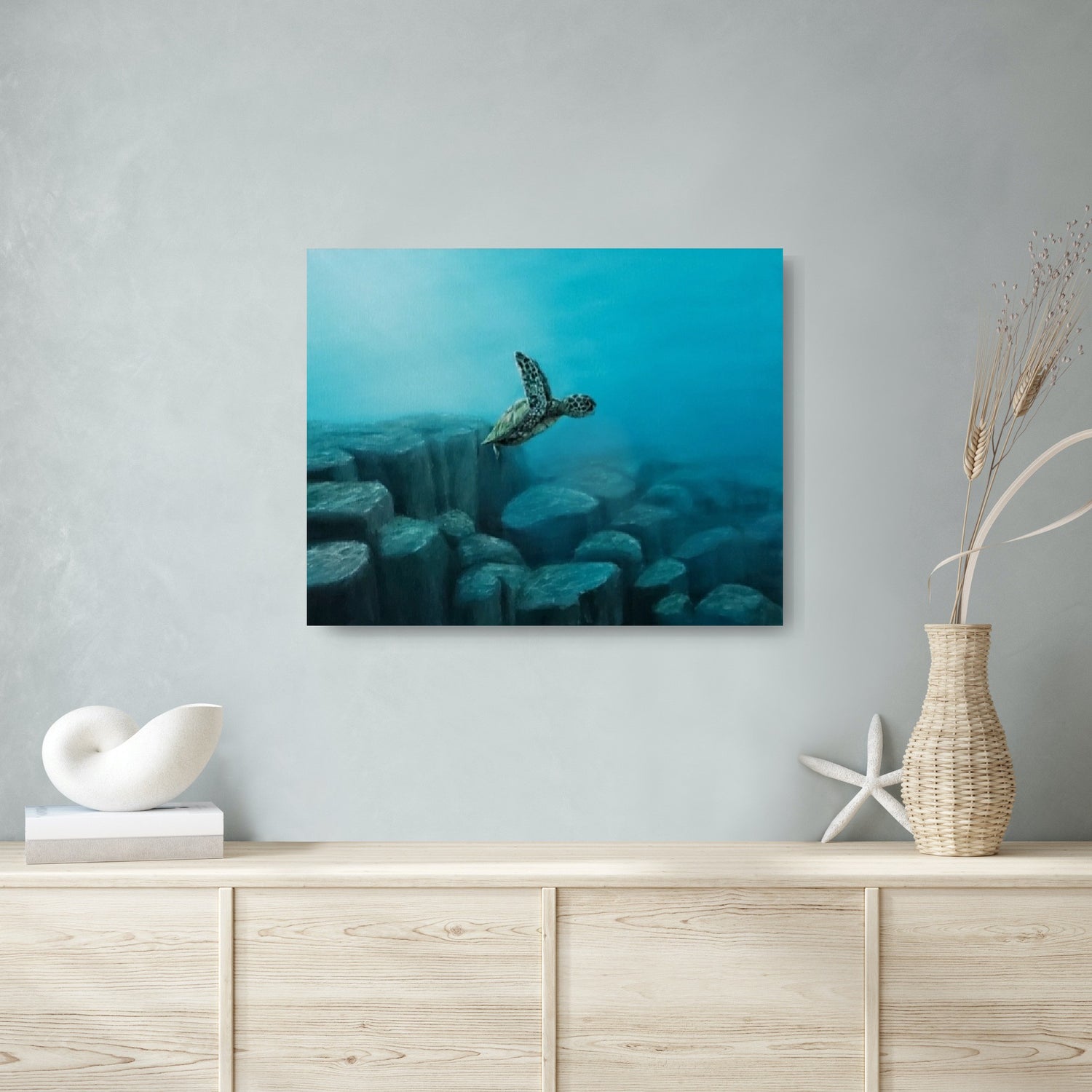 An acrylic painting of a baby turtle swimming over rocks in the deep blue ocean. After snorkeling in Molokini Crater in Maui, I learned that this location inspired the creators of Finding Nemo to write the famous "drop-off" scene. I felt an urge to capture this moment as a painting thanks to photographer Jeremy Bishop. 16 x 20" acrylic on canvas