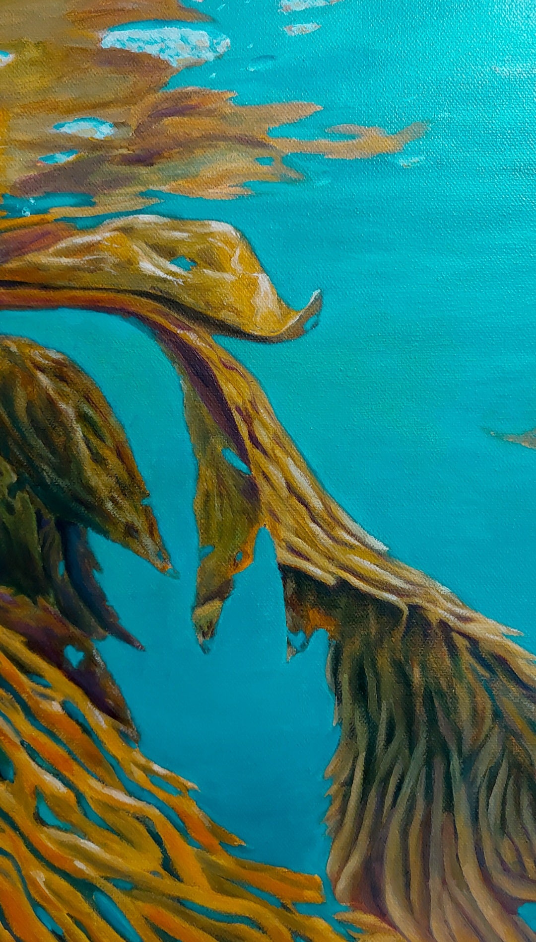 Recover is an oil painting on canvas by Katherine Polack of a mustard coloured sea kelp in a brightly coloured turquoise emerald water. It's reflection can be seen on the surface on the top 1/3 of the painting. Recover symbolizes the resilience and strength that we all have within us and was inspired by the documentary My Octopus Teacher. Find the many hidden hearts in the painting. 18 x 24" oil on canvas